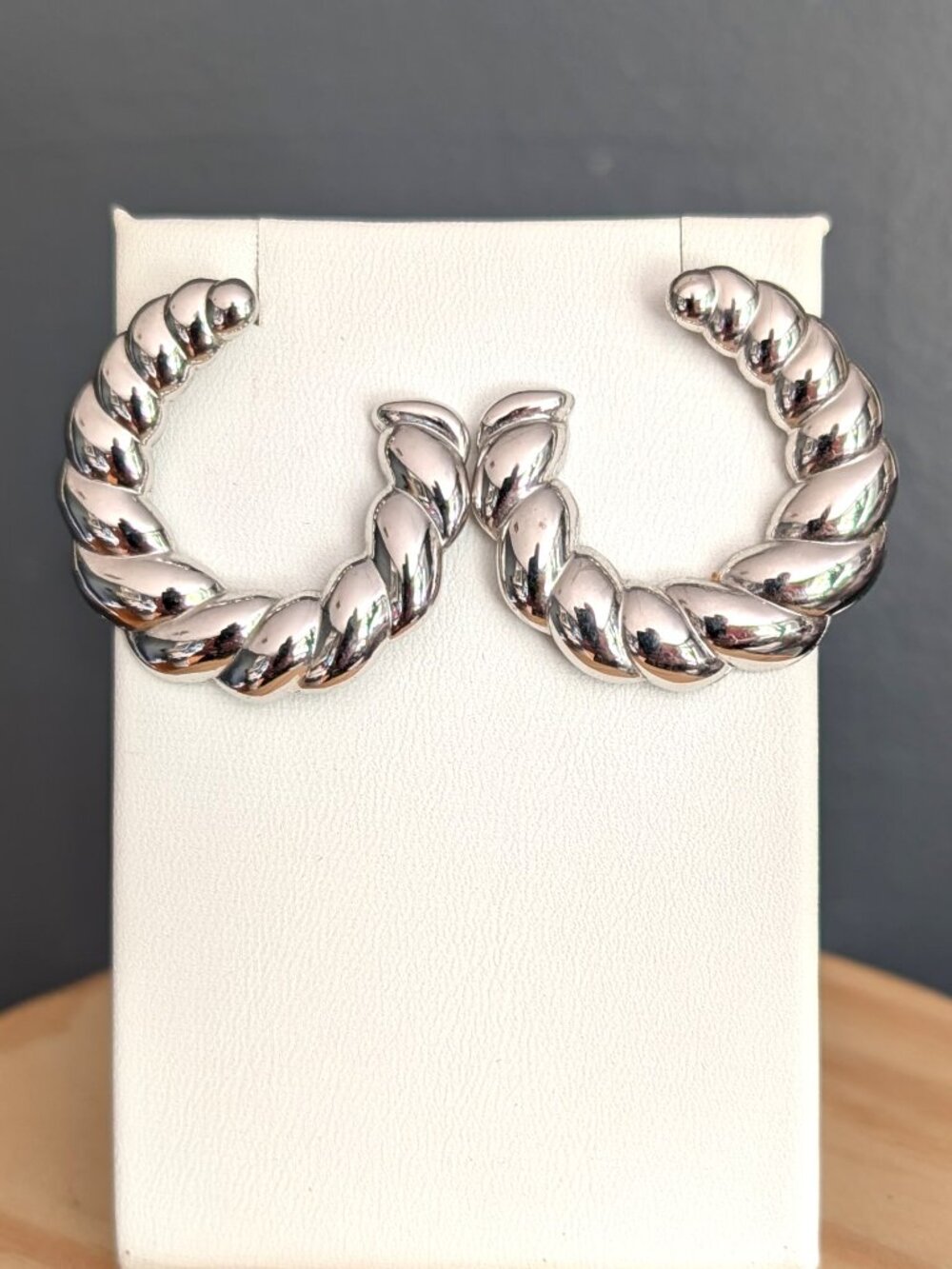 Open hoop silver tone twisted earrings